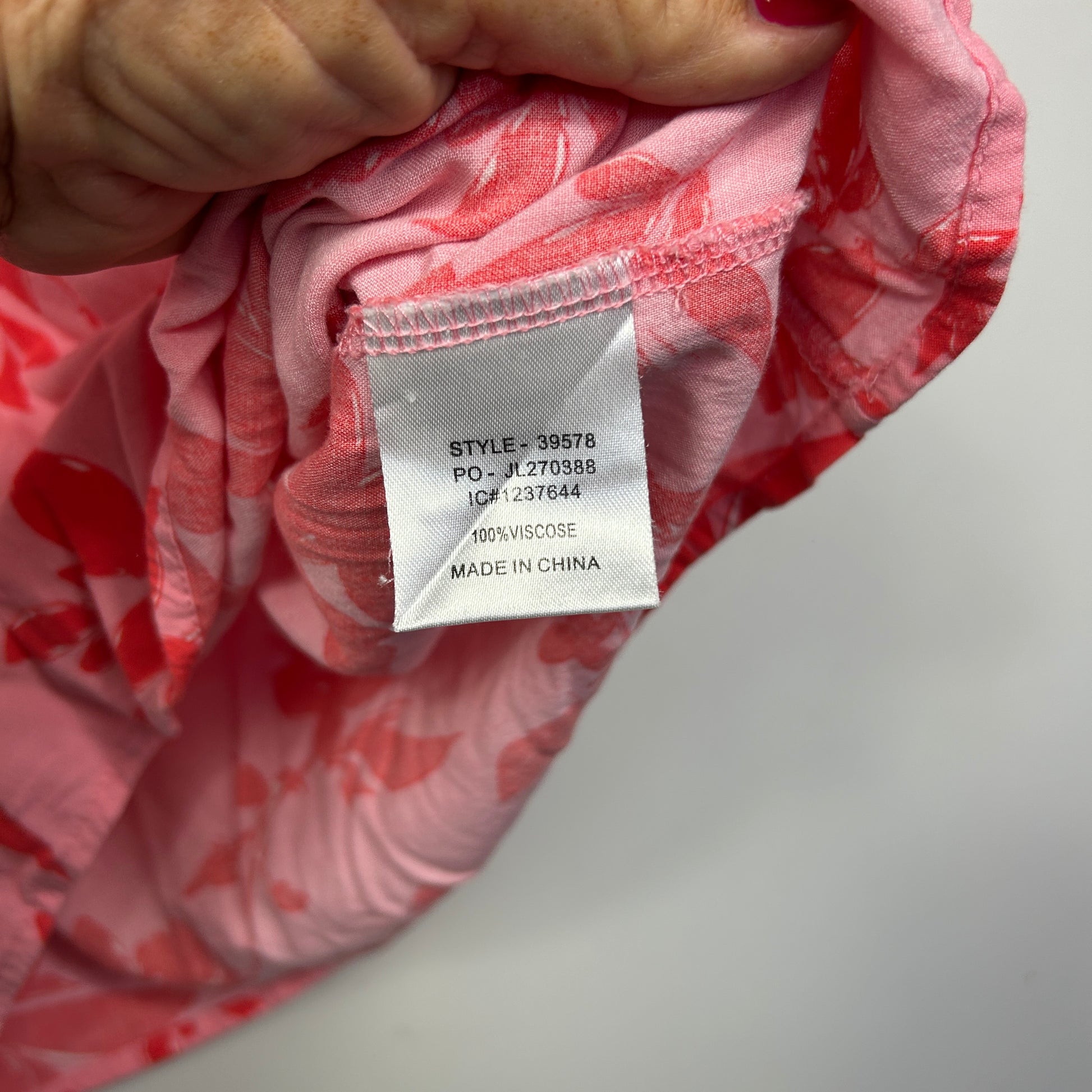 Pink patterned fabric label detail view
