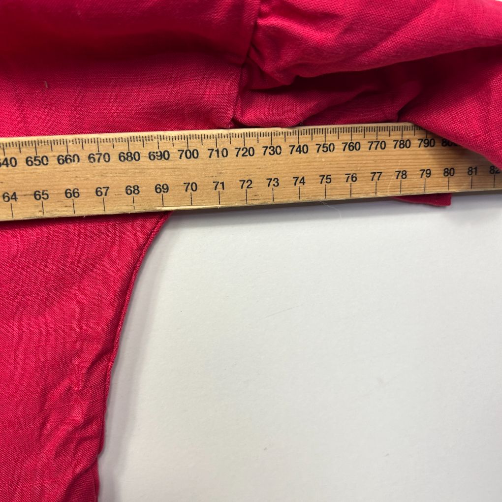 Red fabric with measurement ruler detail view