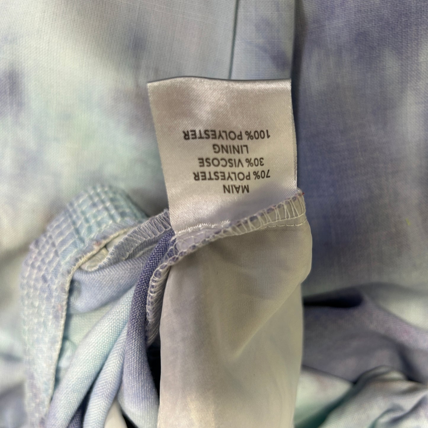 Blue and white striped shirt label detail view