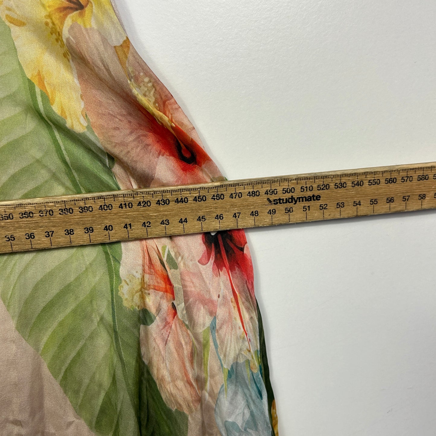 Multicolored fabric detail view with measuring tape