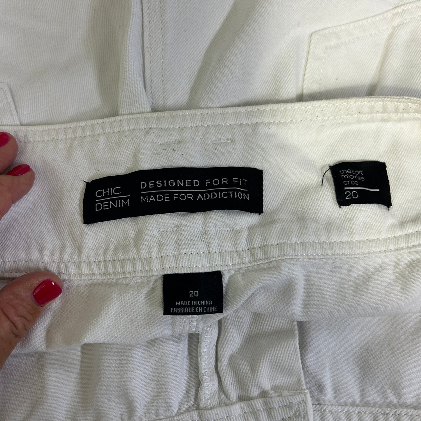 White denim jeans label detail view
