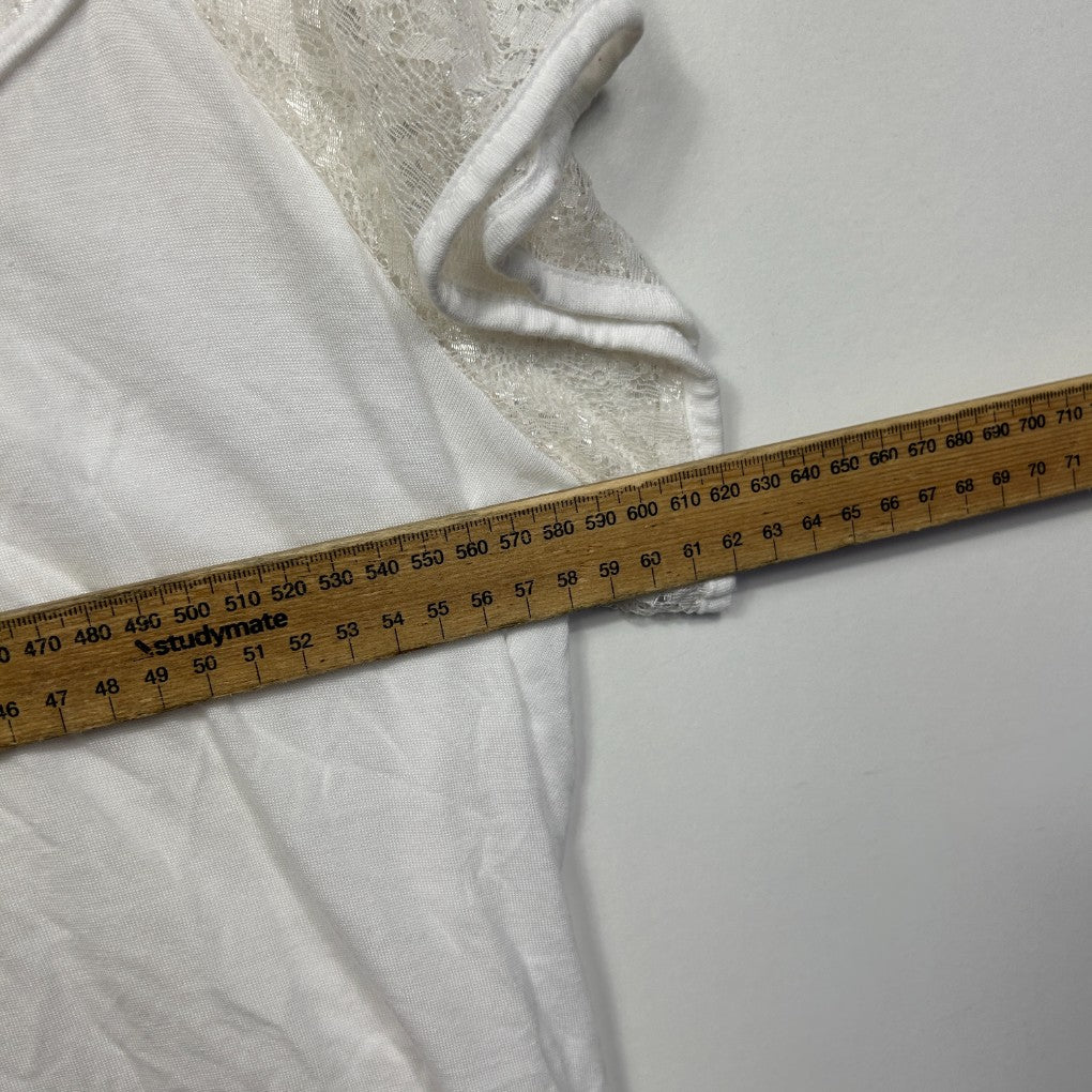 White fabric detail view with measuring tape