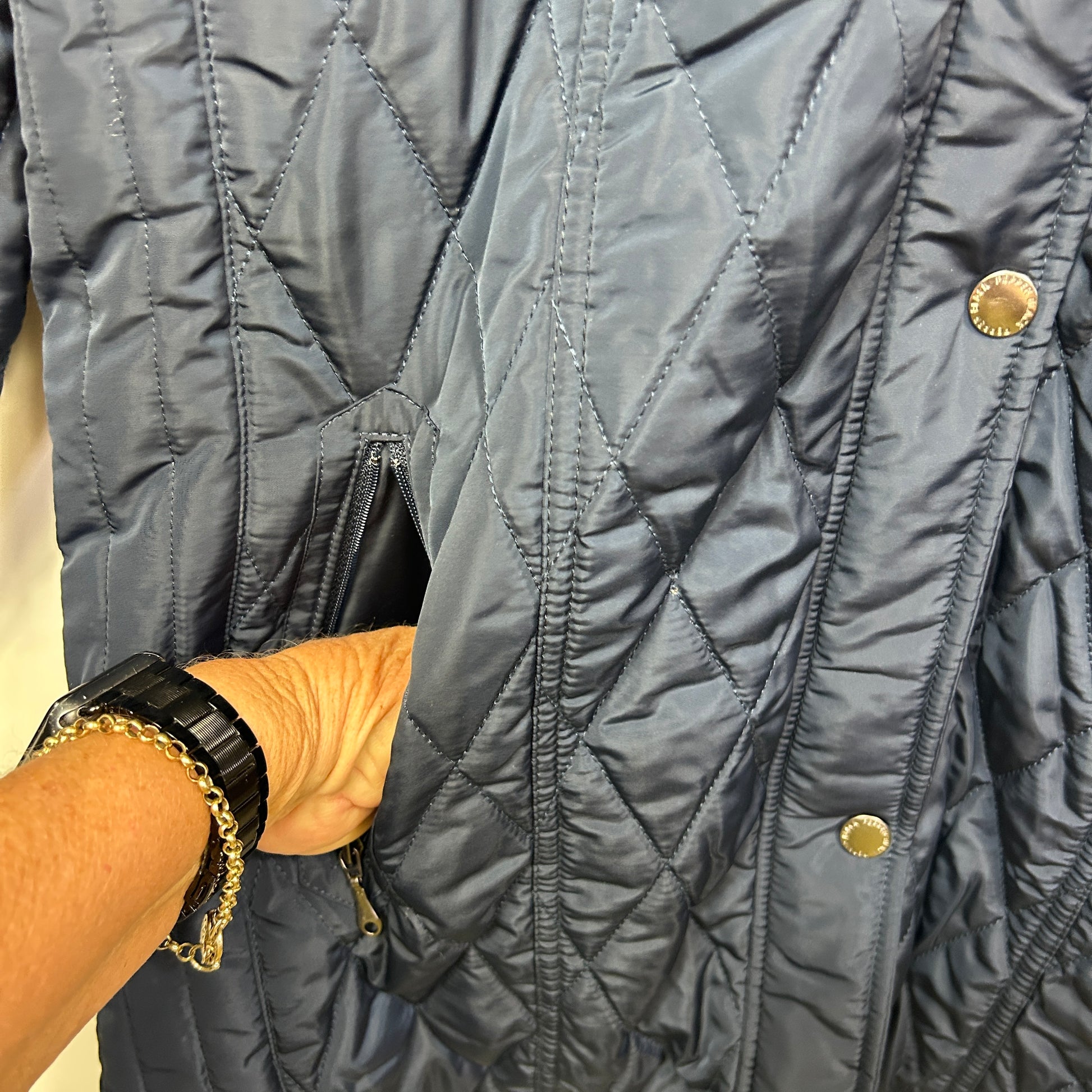 Navy quilted jacket detail view