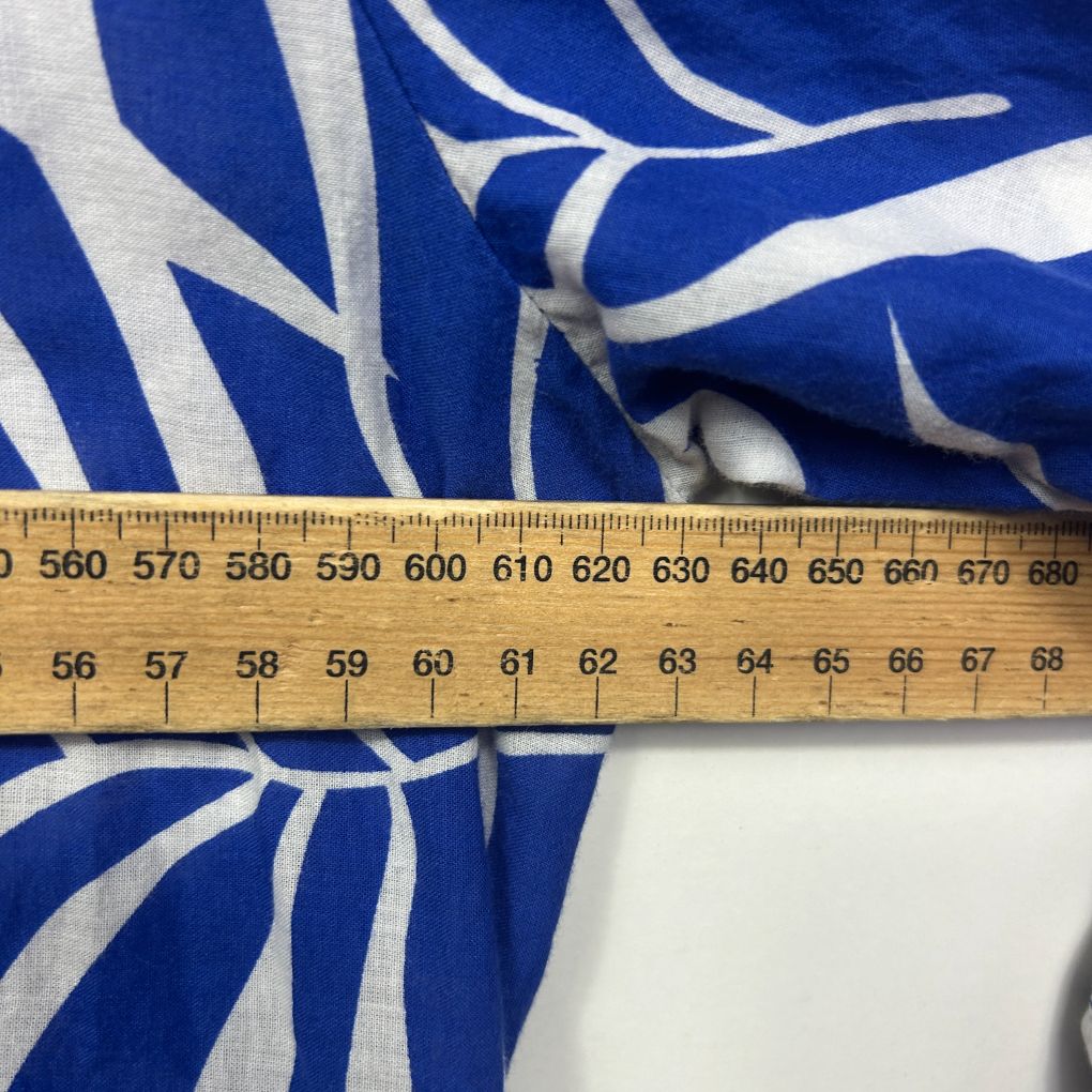 Blue and white striped fabric detail view with measuring ruler