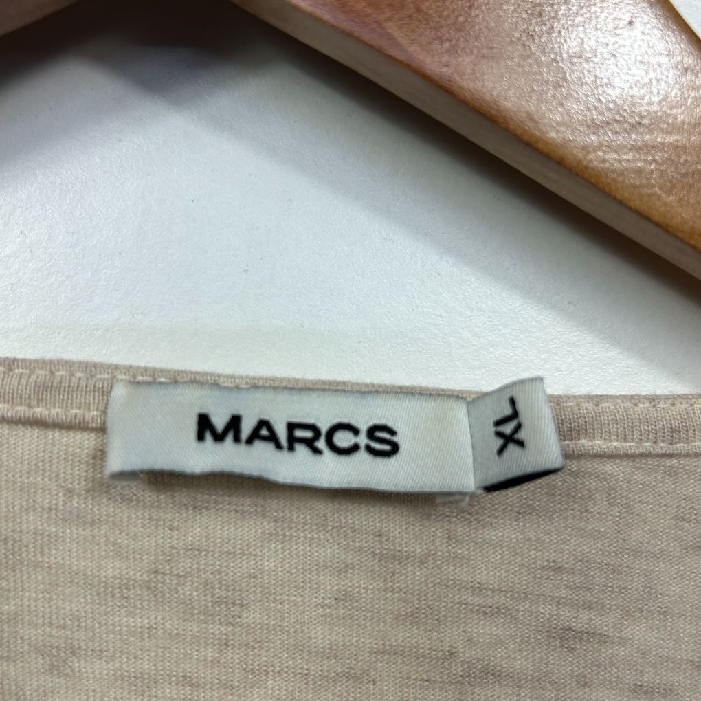 Beige garment label detail view