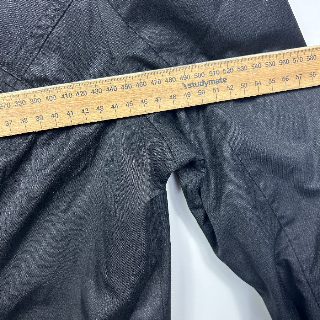 Dark grey trousers with measuring tape detail view