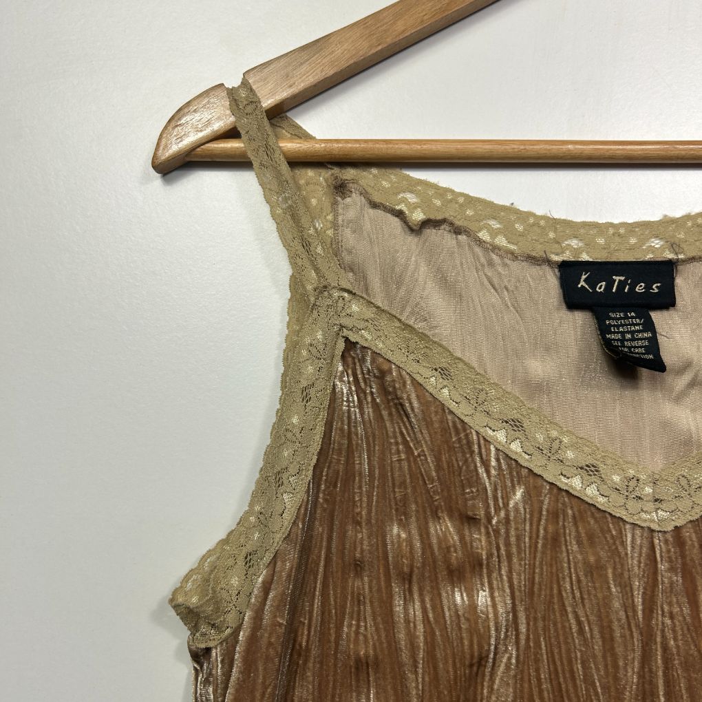 Beige pleated dress detail view on hanger