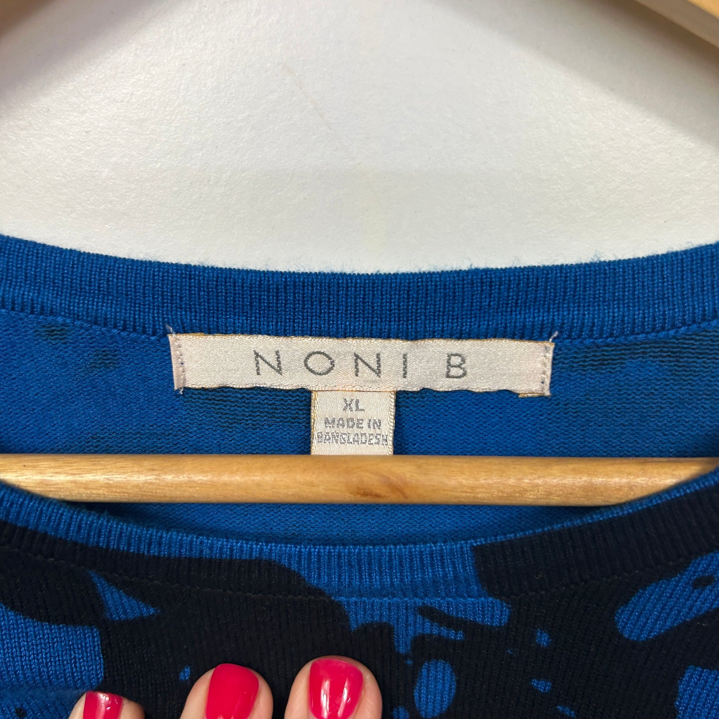 Blue top with graphic print detail view