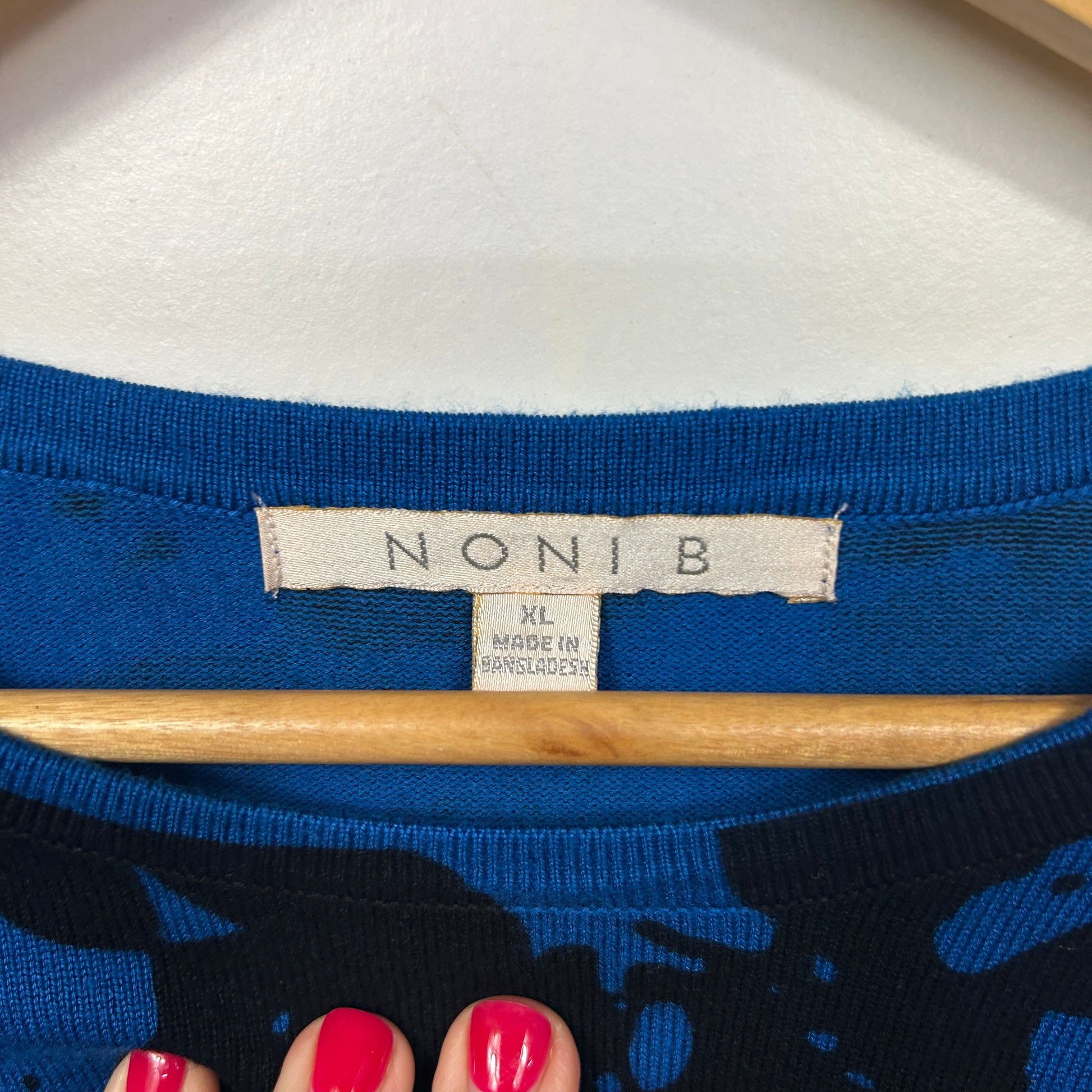 Blue top with graphic print detail view