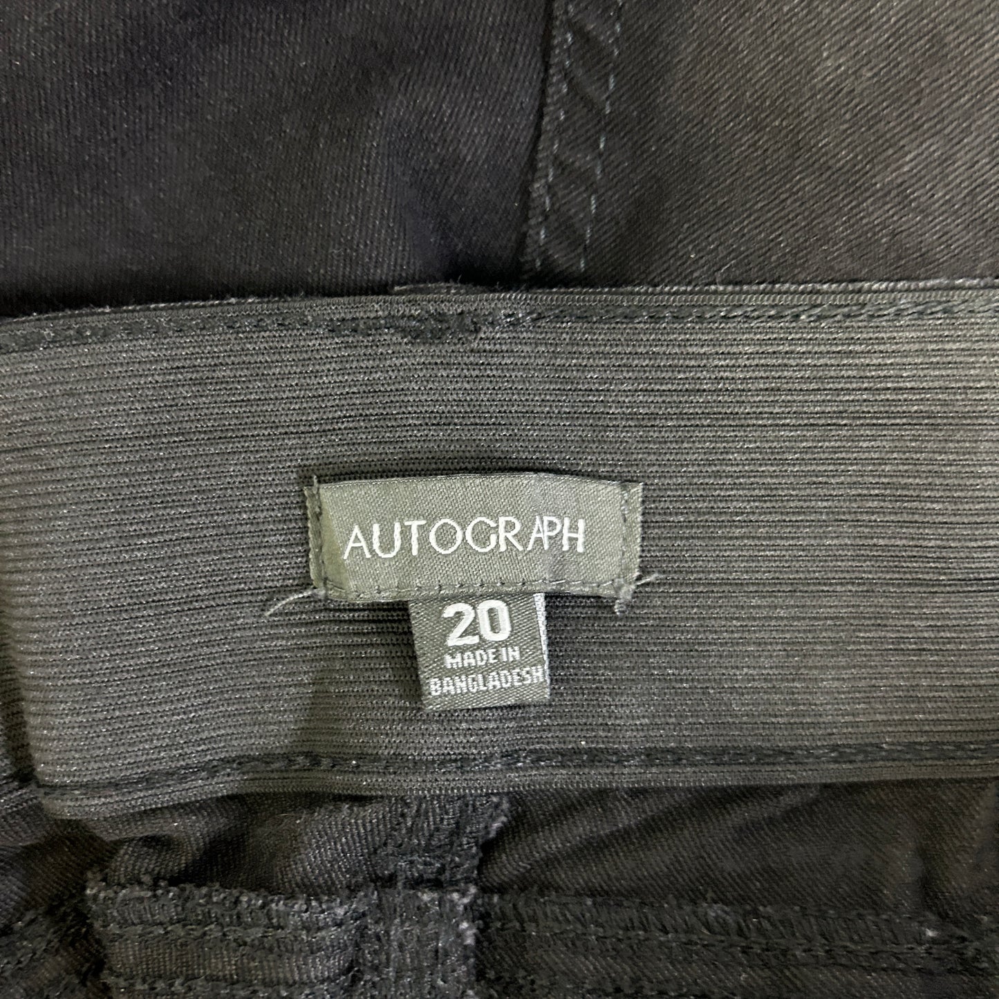 Green striped shirt label detail view