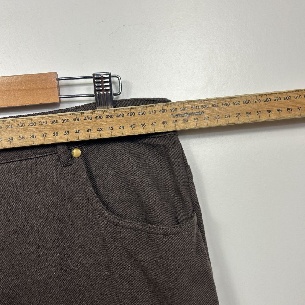 Brown pants front view with measuring tape