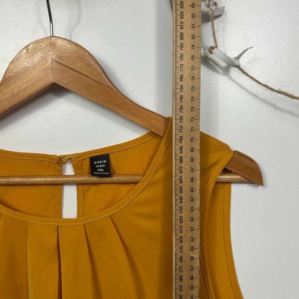 Golden yellow sleeveless top front view with measurement scale