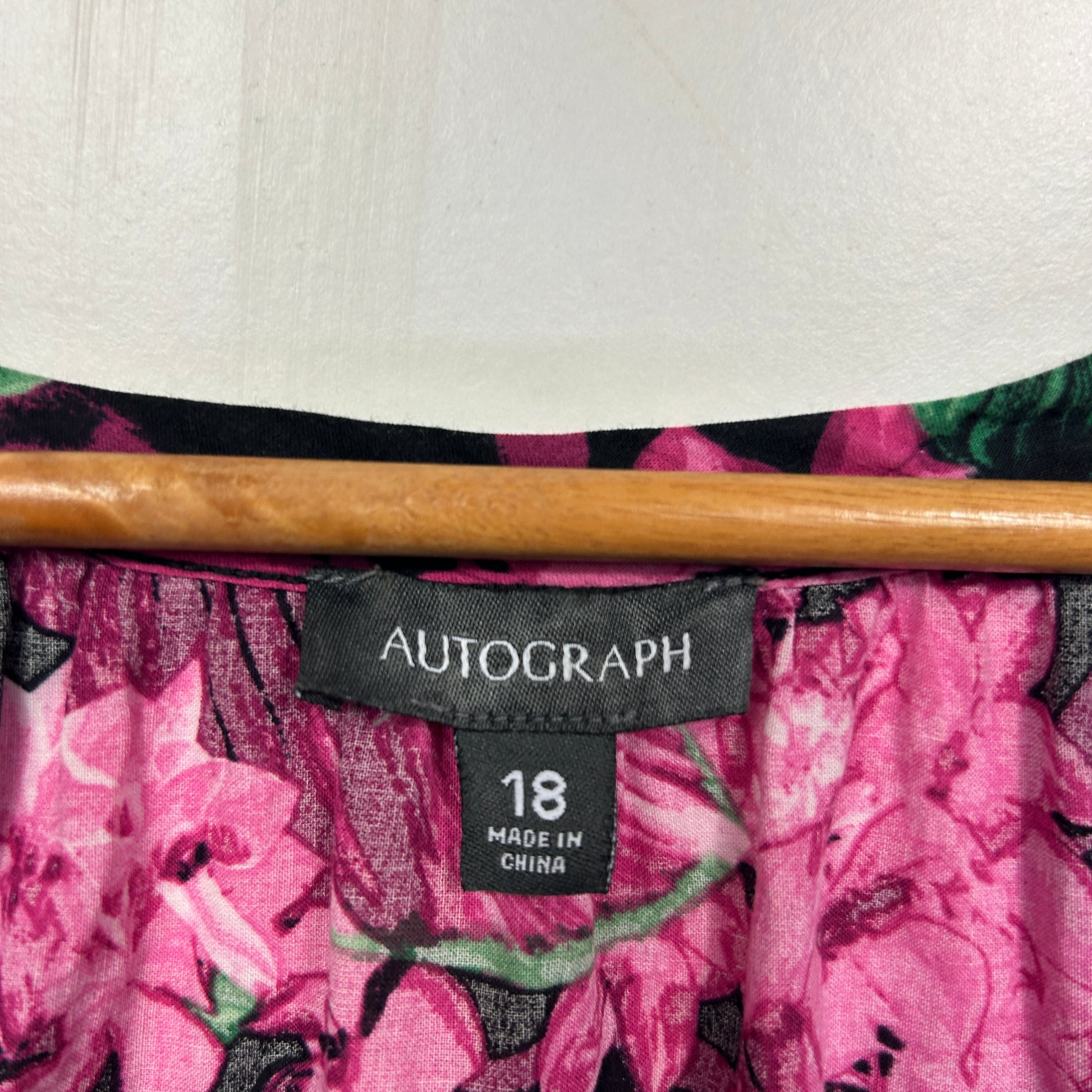 Pink floral dress label detail view