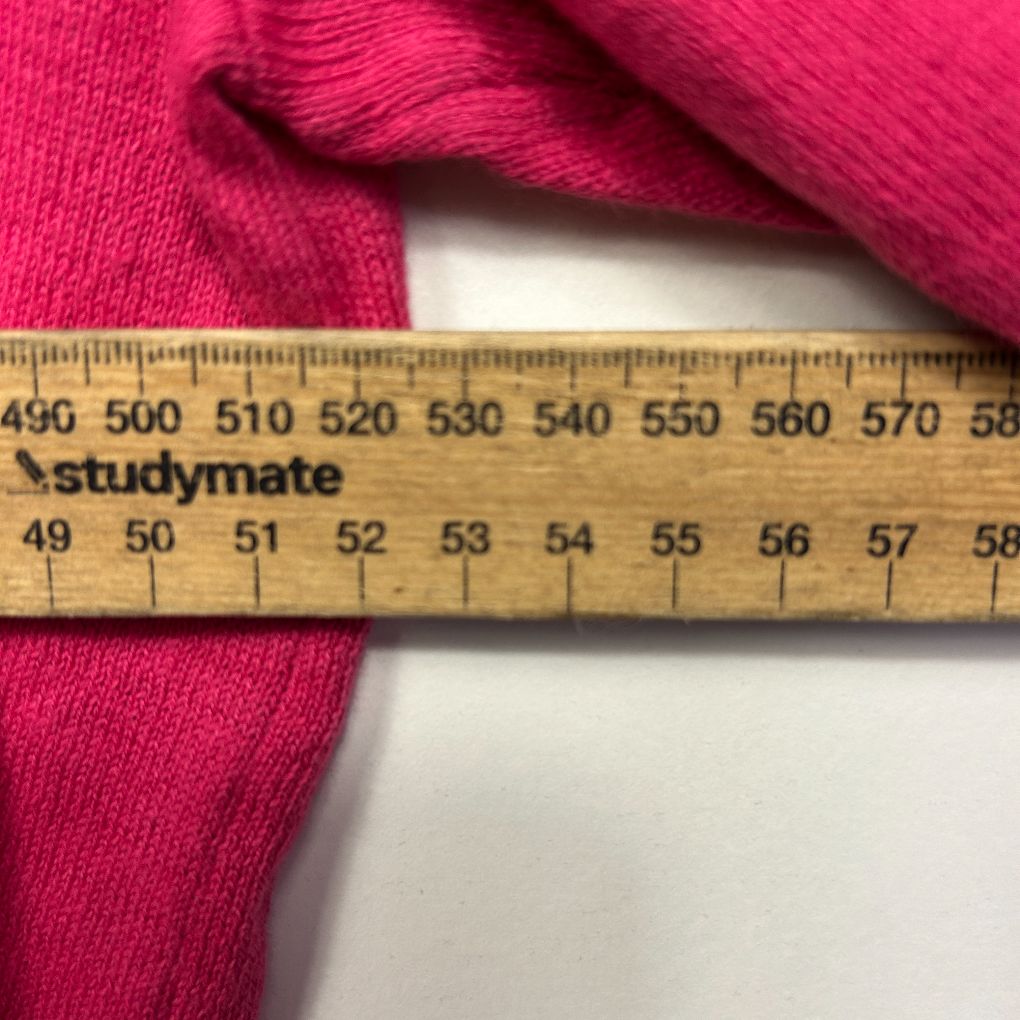 Hot pink ribbed fabric detail view with measuring ruler