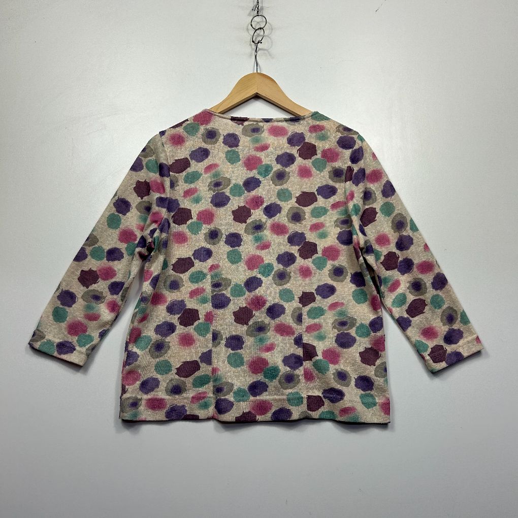Grey long sleeve top with purple and pink polka dot pattern front view