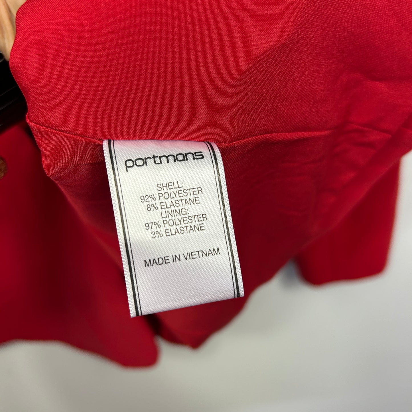 Red garment label detail view