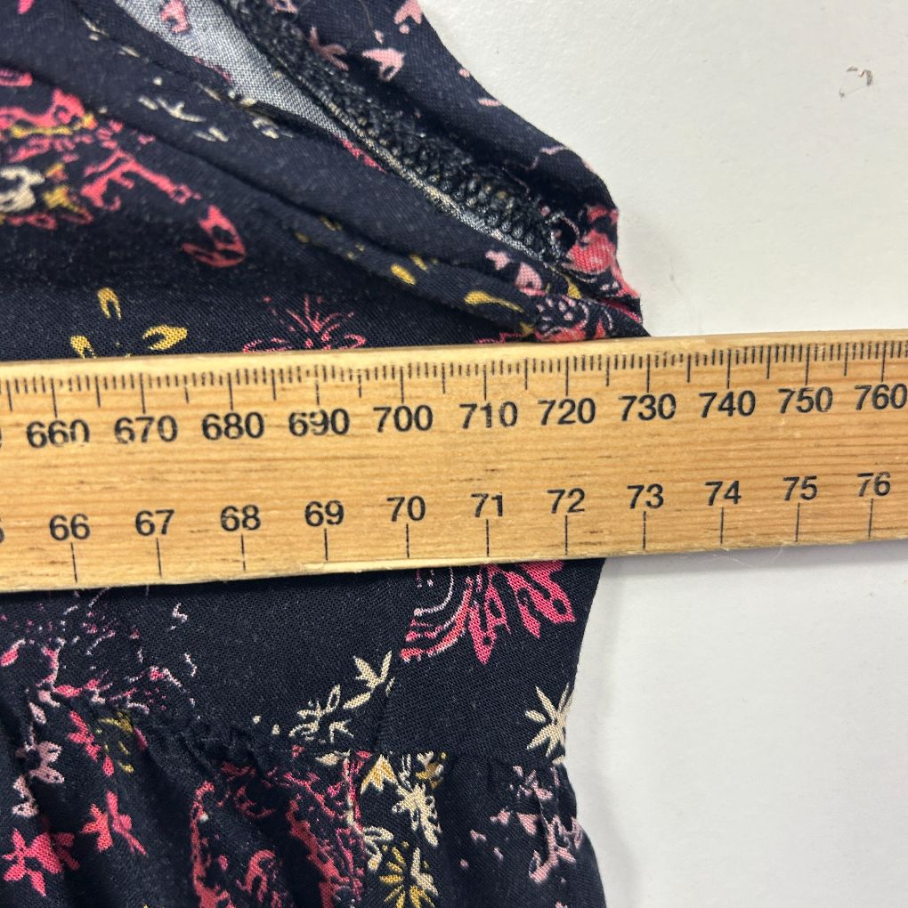 Navy floral fabric detail view with measuring ruler