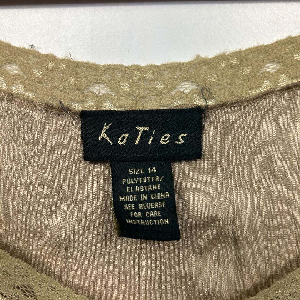 Beige cardigan front view with label detail