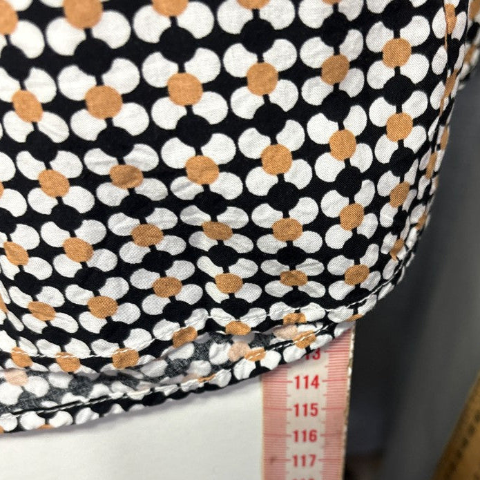 Black white and tan polka dot dress detail view