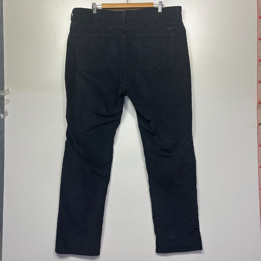 Black distressed jeans back view