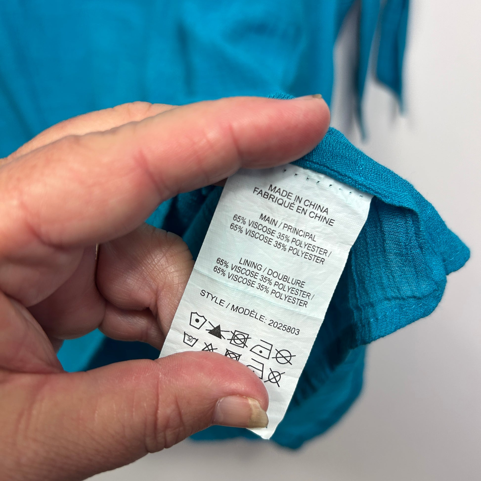 Blue garment care label detail view