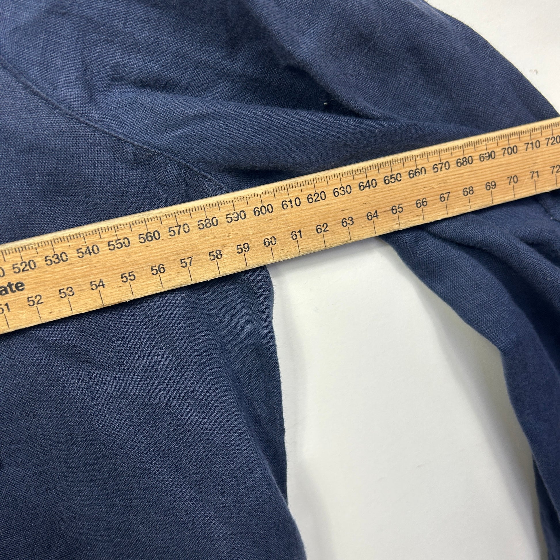 Navy blue fabric with measuring tape detail view