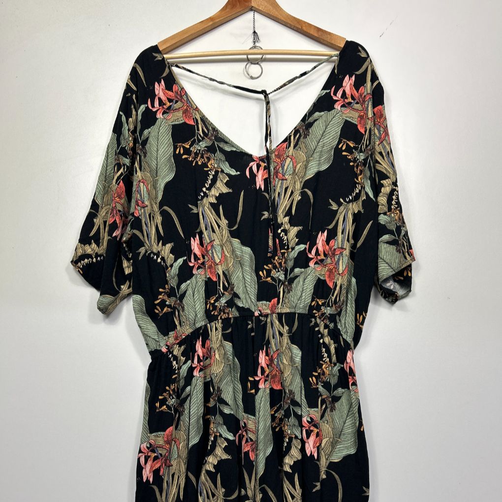 Black floral dress front view on hanger