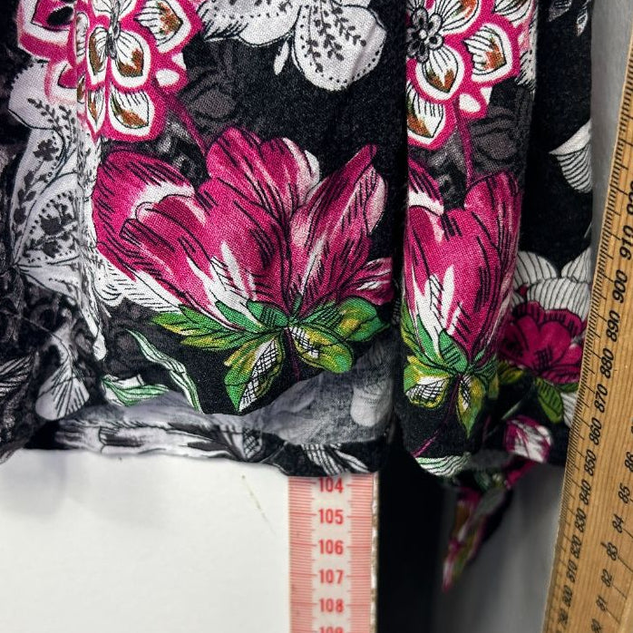 Black and white floral print top front view with pink and magenta flowers