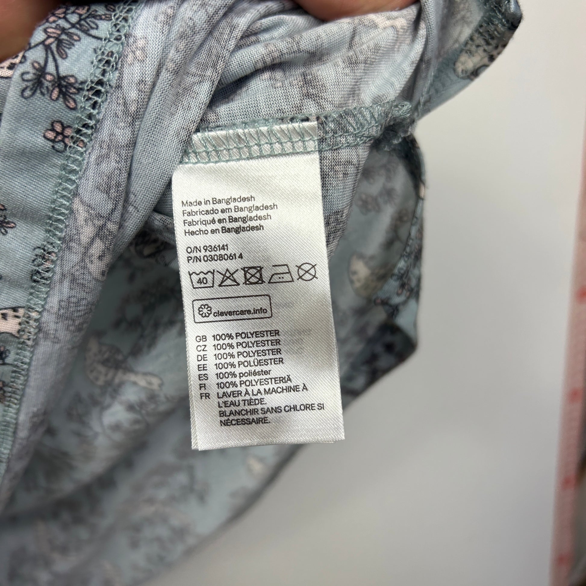 Gray floral shirt label detail view
