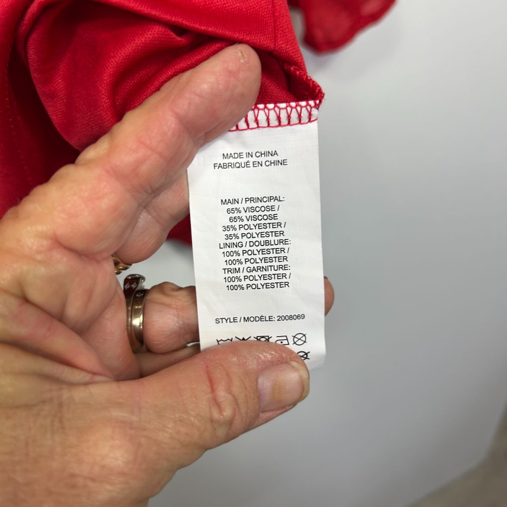 Red garment care label detail view