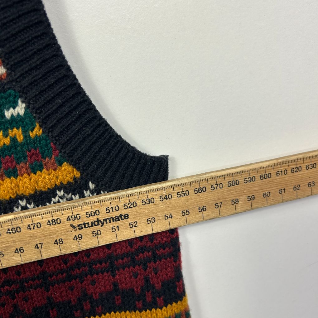Navy knit sweater detail view with measurement tape