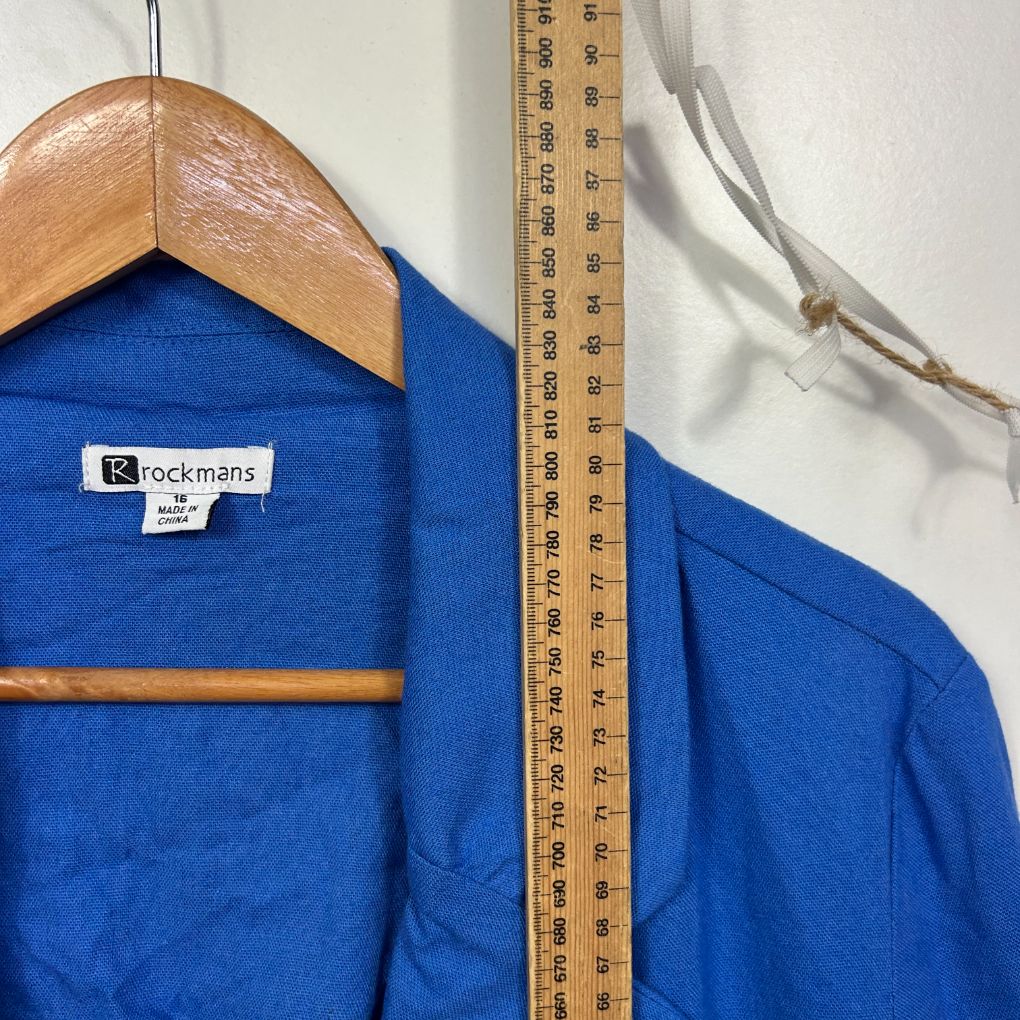 Blue shirt front view on wooden hanger