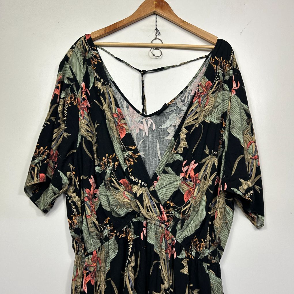 Black floral dress front view on wooden hanger