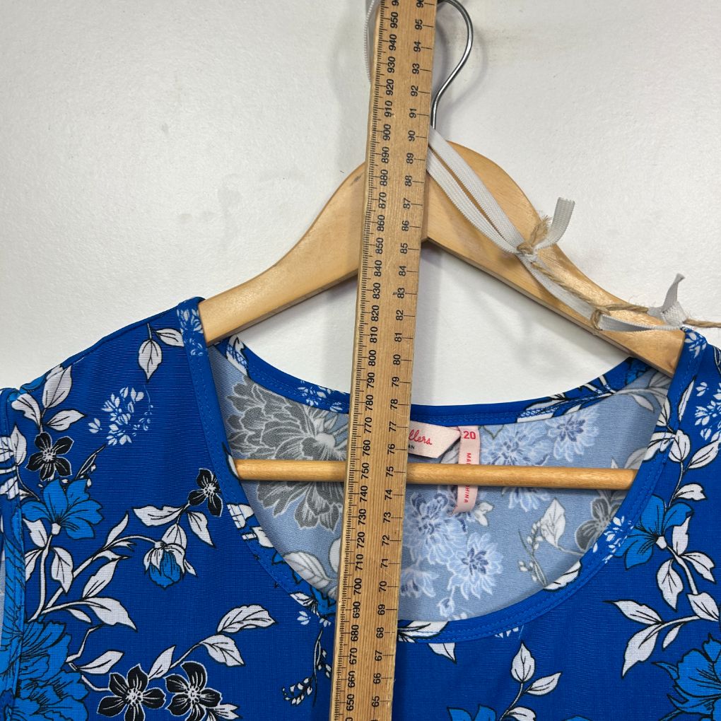 Blue floral dress front view with measuring tape