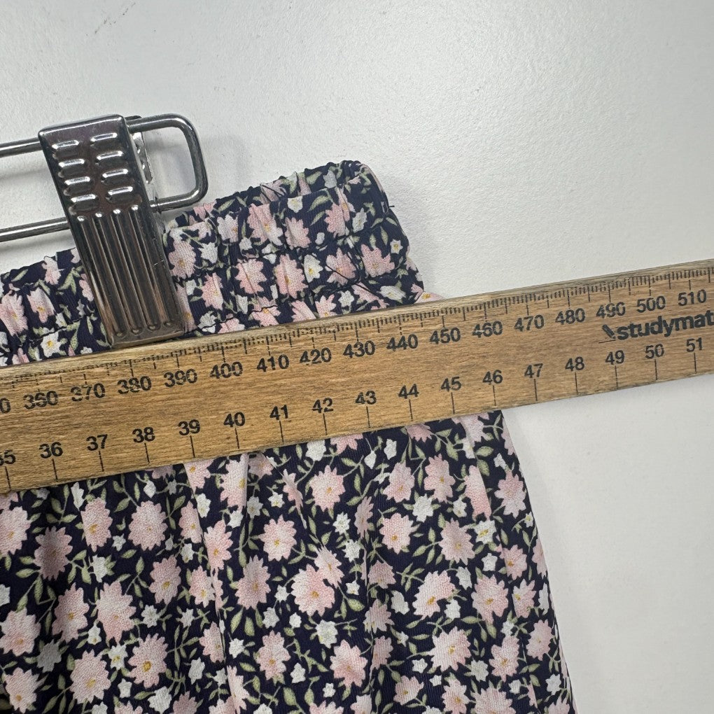 Navy floral dress with measurement tape detail view
