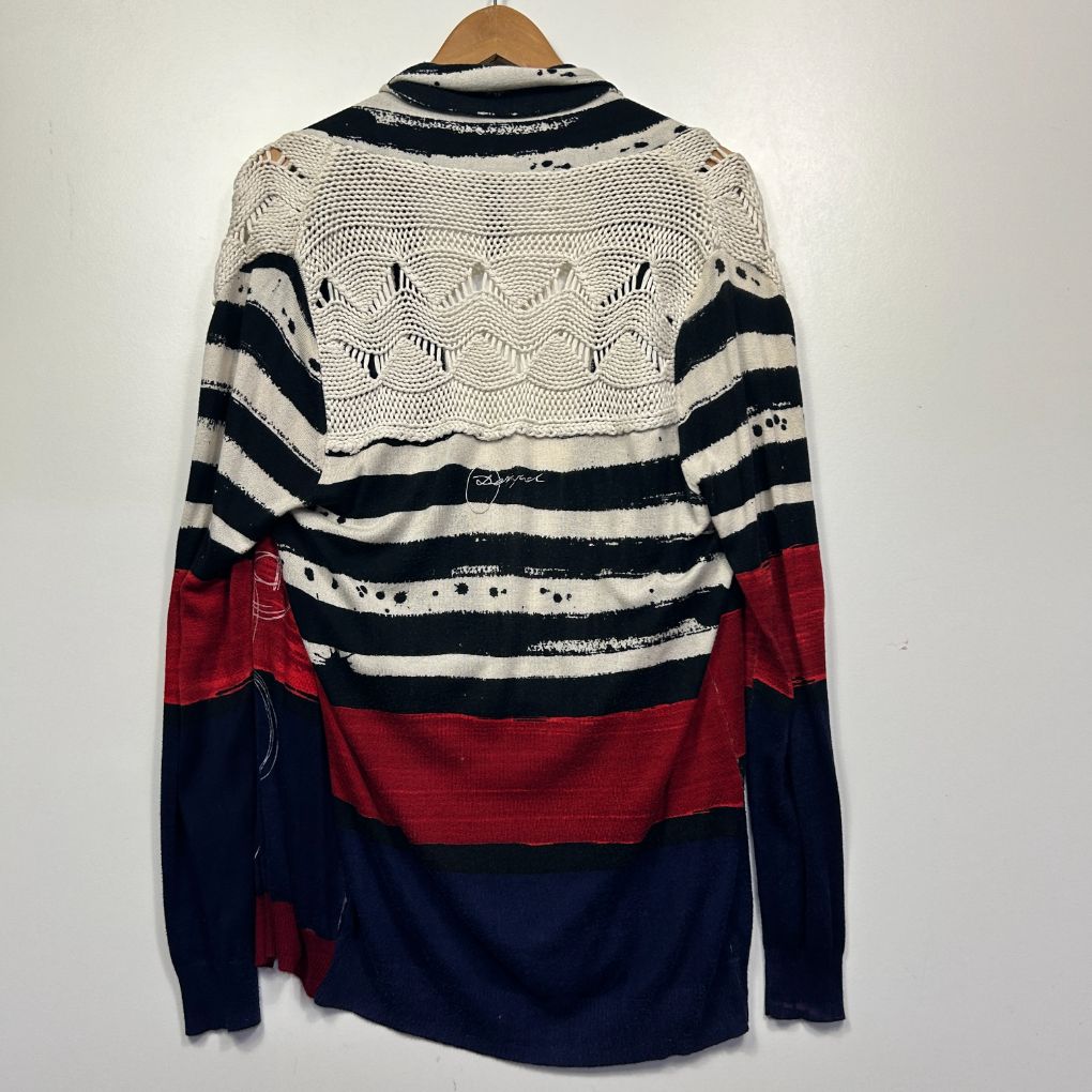 Cream navy and red striped knit sweater back view