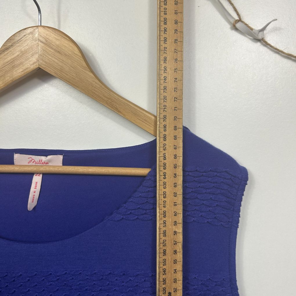 Blue sleeveless top front view with measuring tape