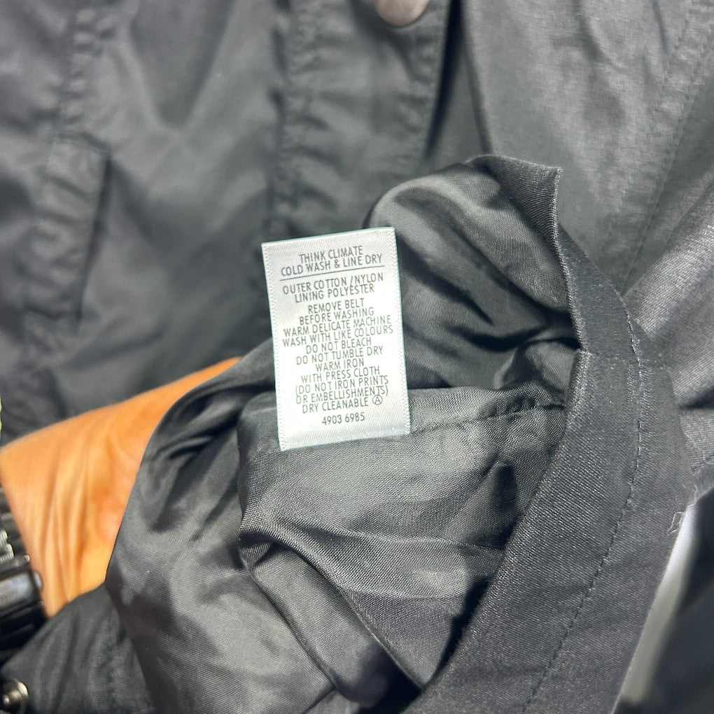 Black jacket with orange trim detail view