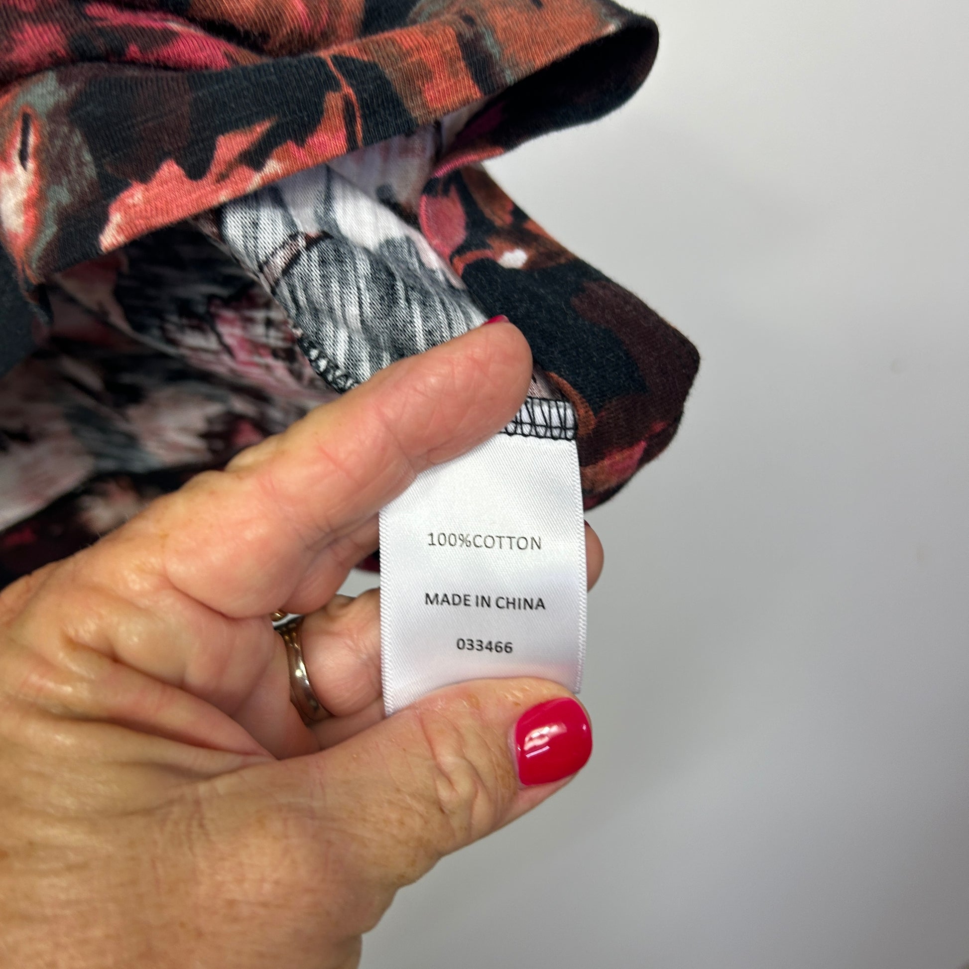 Burgundy and black plaid shirt label detail view