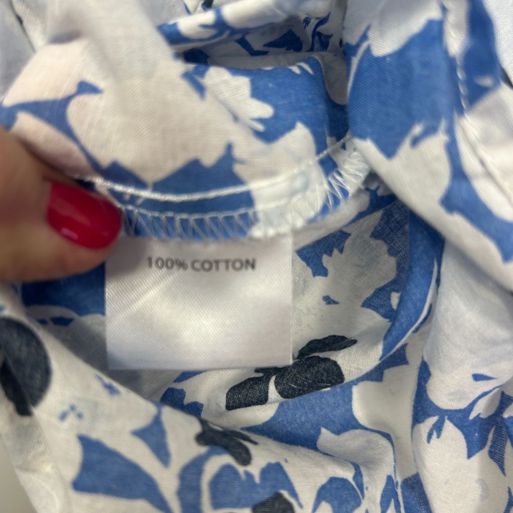 Blue and white floral cotton garment label detail