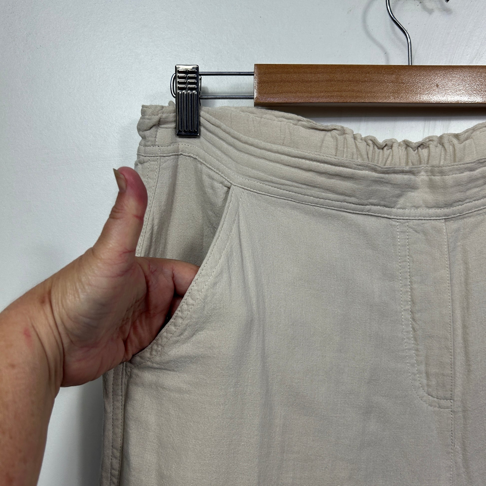 Beige shorts detail view on hanger