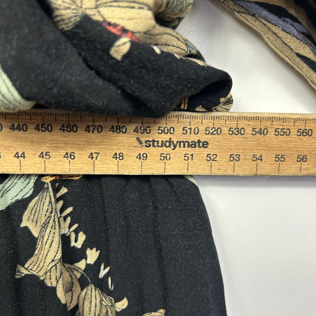 Black cardigan with gold embroidered detail view