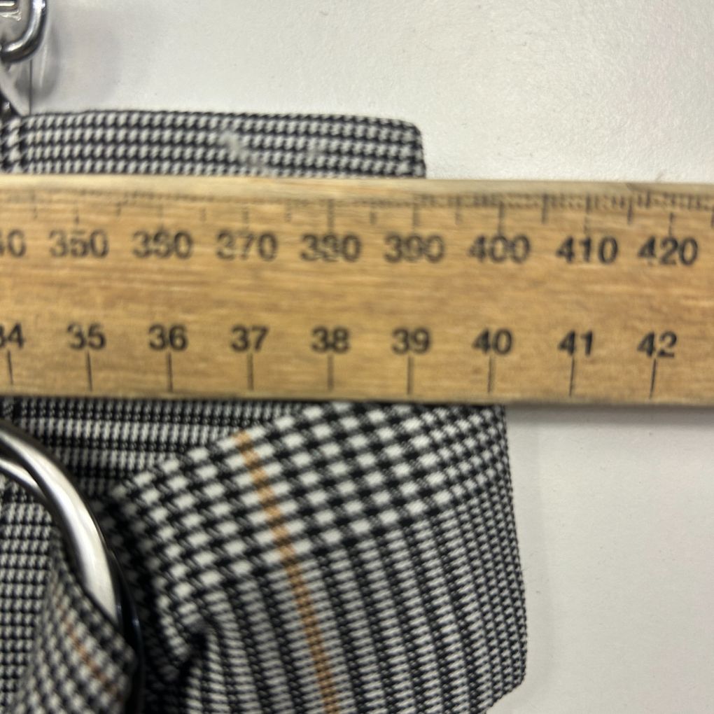 Black and white gingham fabric detail view with measuring ruler