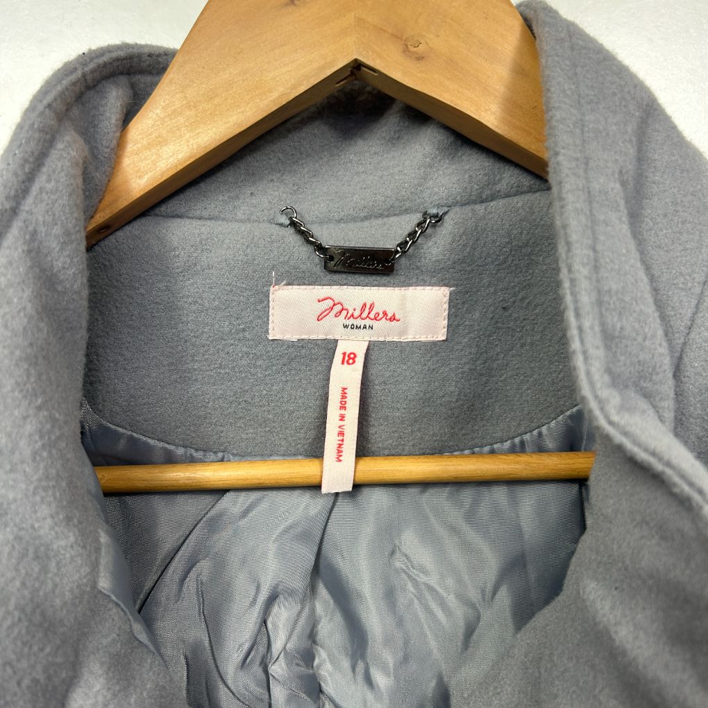 Light blue jumper front view on hanger