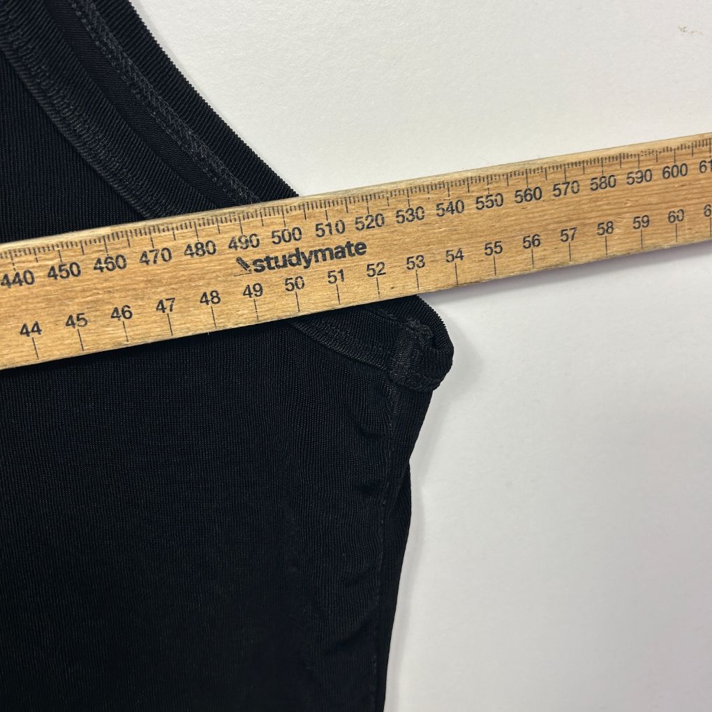 Black fabric with measuring tape detail view