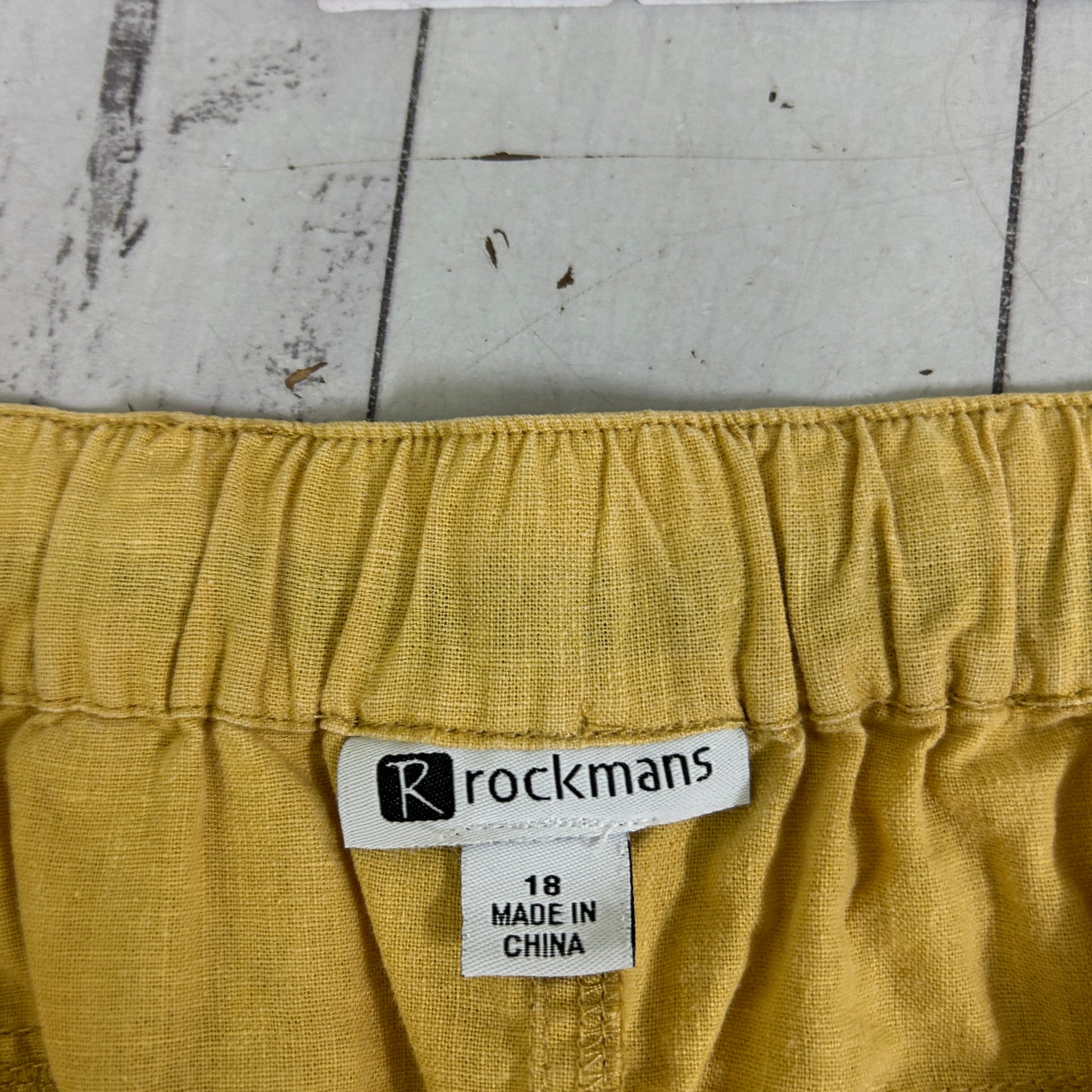 Yellow shorts detail view showing Rockmans label