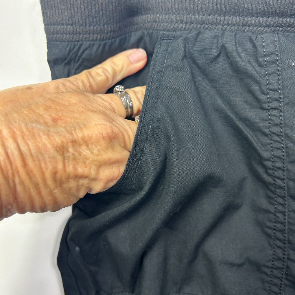 Grey shorts detail view showing pocket and waistband