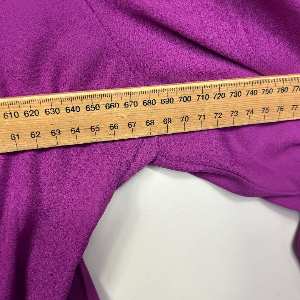 Purple fabric with measuring tape detail view