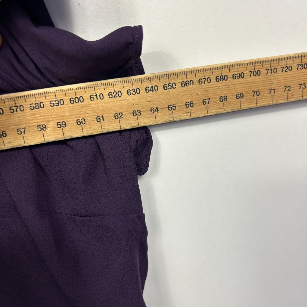 Purple fabric with measuring tape detail view
