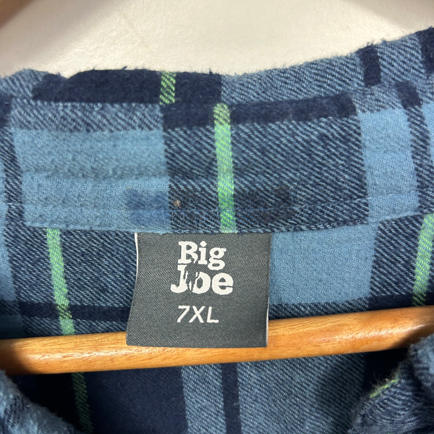 Navy blue checked shirt label detail view
